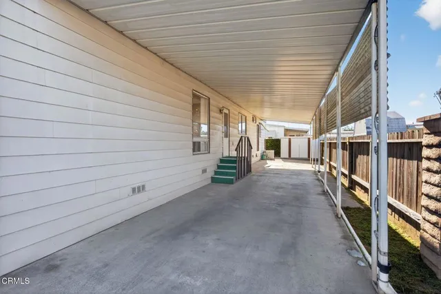 a view of a porch with wooden stairs