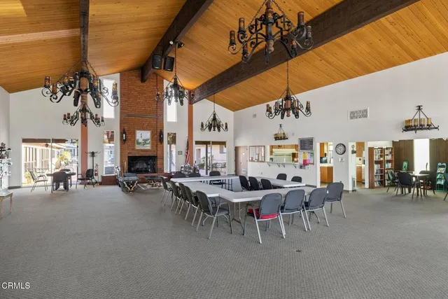a view of a patio with table and chairs and potted plants