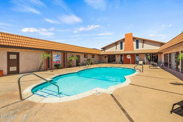 a living room with patio furniture