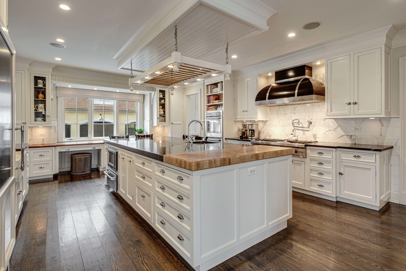 Undisclosed Address Lake Forest, IL 60045 - Photo 28 of 75 a kitchen with stainless steel appliances sink stove cabinets and wooden floor