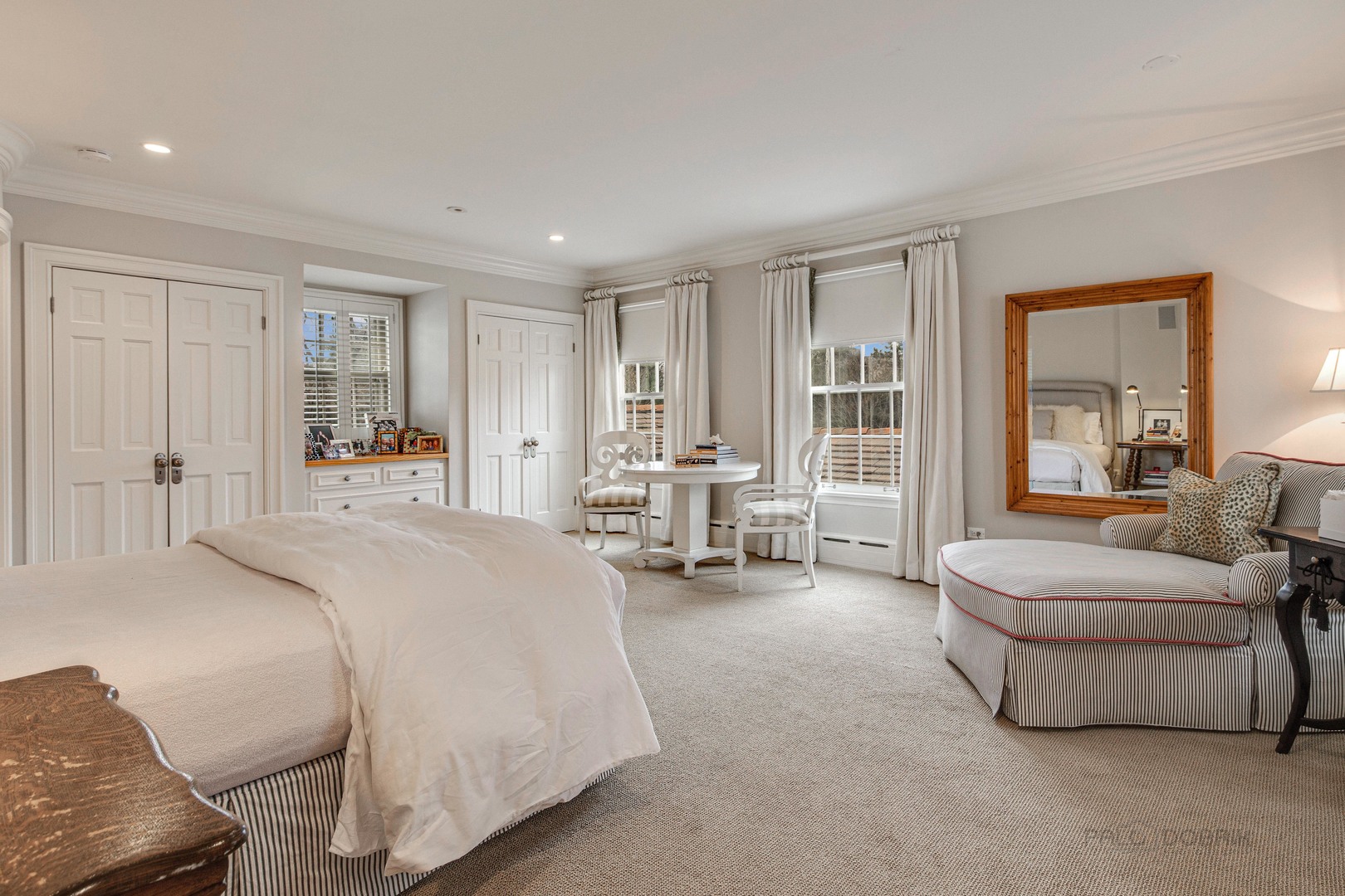 Undisclosed Address Lake Forest, IL 60045 - Photo 48 of 75 a spacious bedroom with a bed and large windows