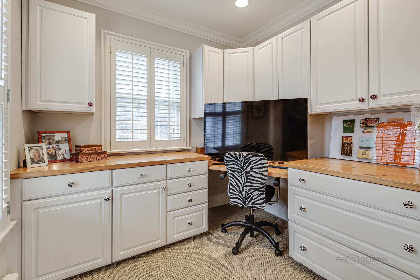 Undisclosed Address Lake Forest, IL 60045 - Photo 49 of 75 a kitchen with white cabinets and chair