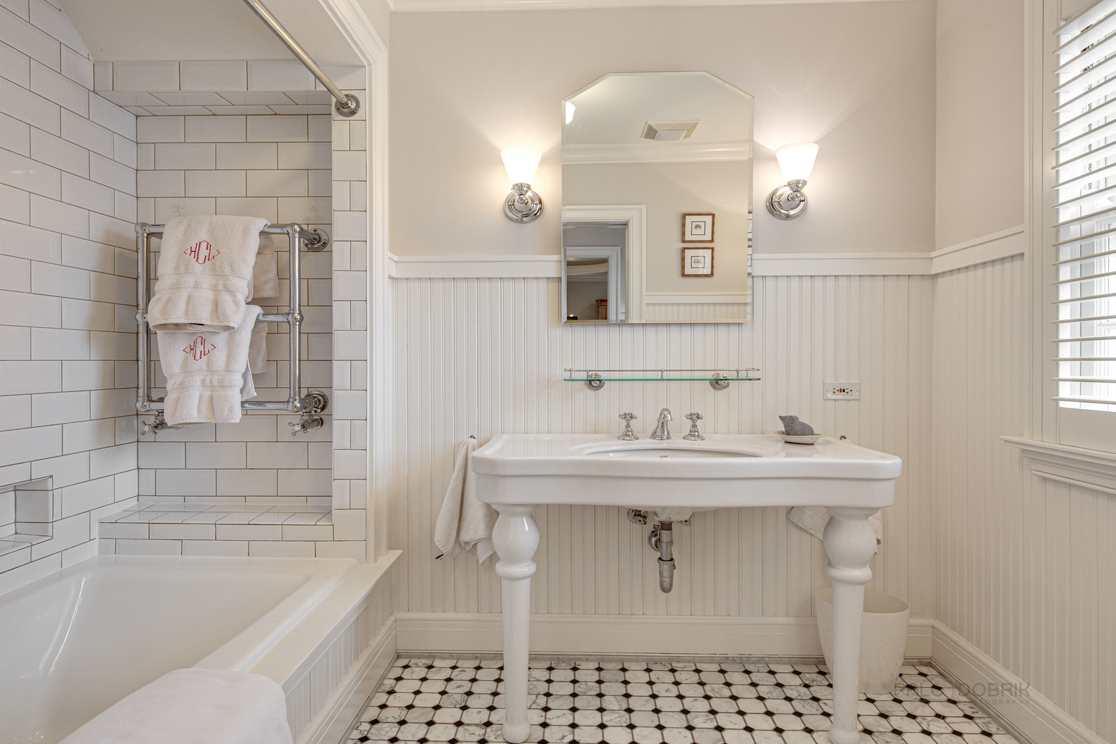Undisclosed Address Lake Forest, IL 60045 - Photo 50 of 75 a bathroom with a sink a toilet a mirror and bathtub