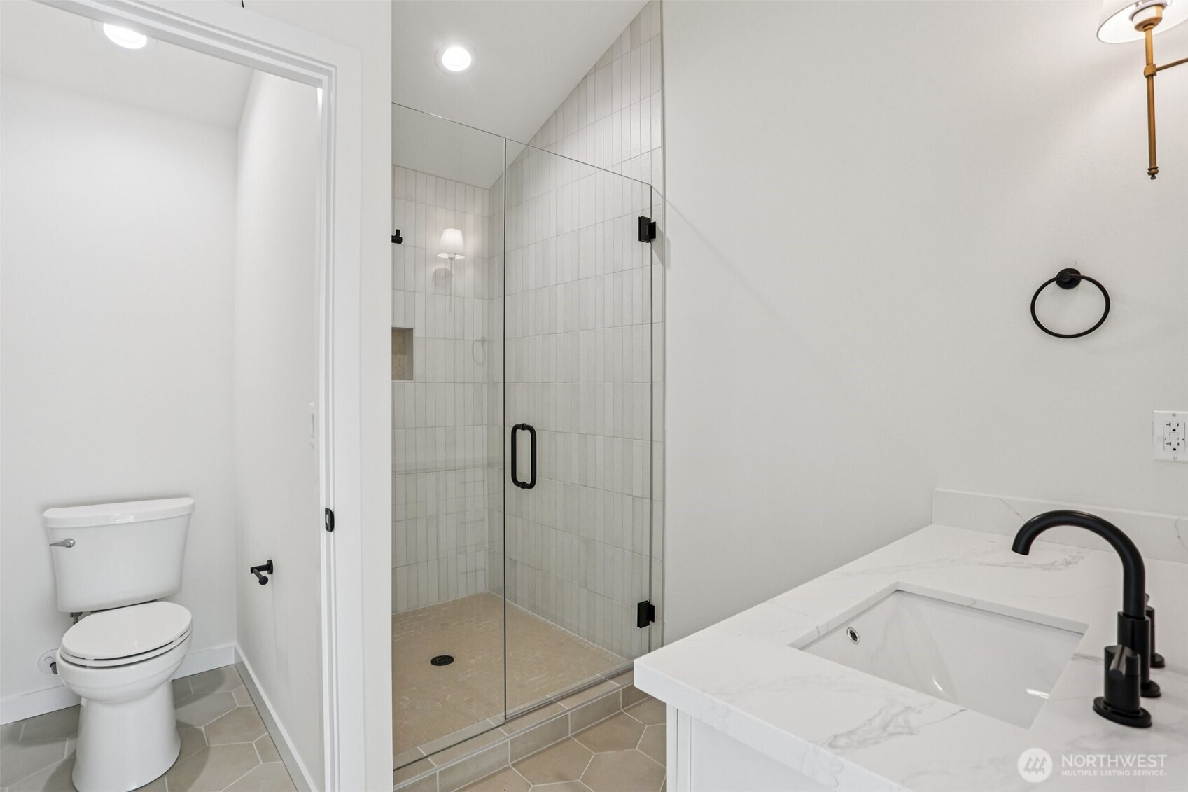 13748 Stone Avenue North Seattle, WA 98133 - Photo 13 of 22 a bathroom with a sink toilet and shower