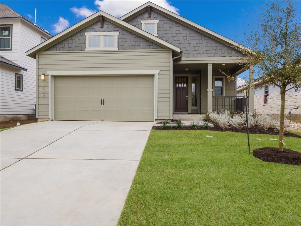 2229 Ringstaff Road Leander, TX 78641 - Photo 1 of 1 a front view of a house with garden