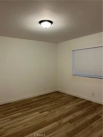 a white toilet sitting next to a bath tub and a shower
