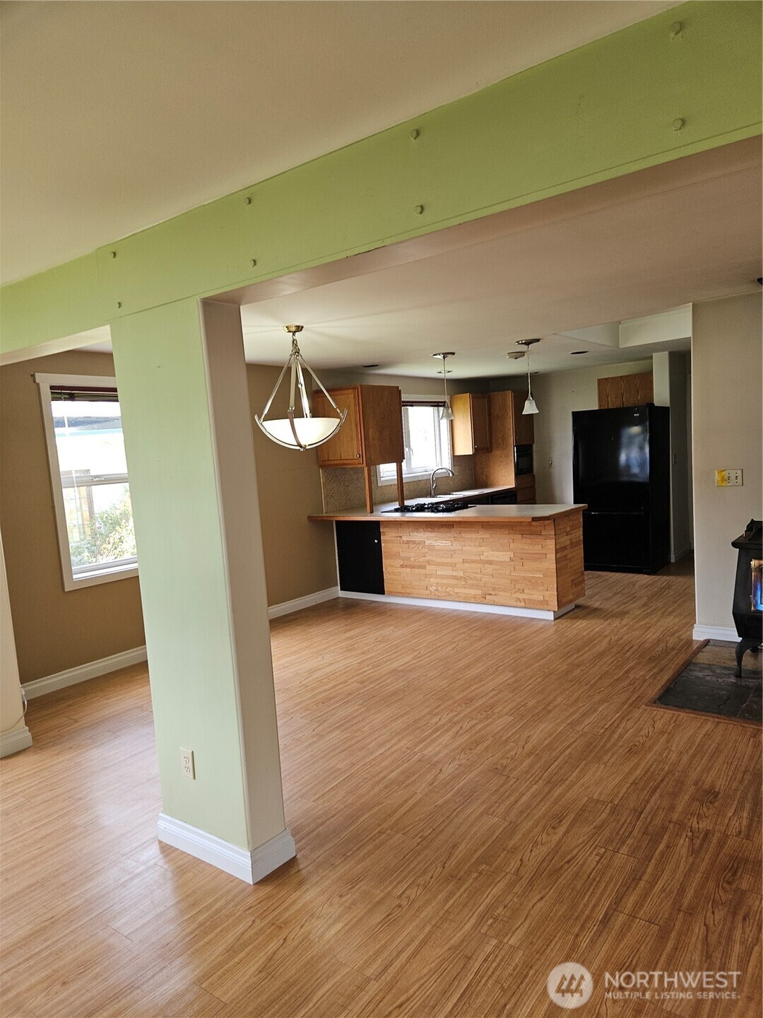 20 East Sunny Sands Road Cathlamet, WA 98612 - Photo 3 of 19 a view of empty room with wooden floor and fireplace