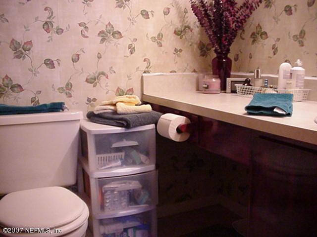 3165 Ricky Drive Jacksonville, FL 32223 - Photo 6 of 8 a bathroom with a sink toilet and vanity