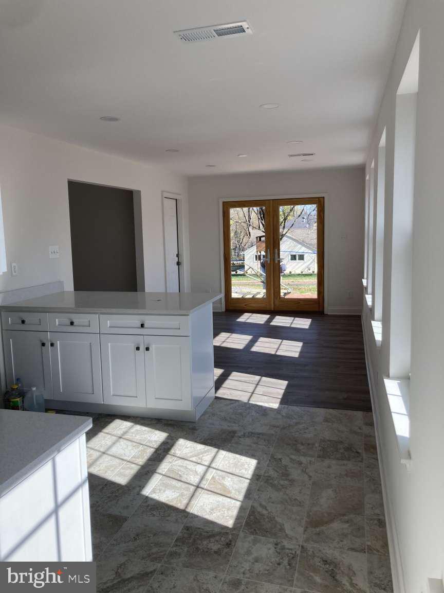 806 Rhodes Avenue Jenkintown, PA 19046 - Photo 4 of 16 a living room with furniture and a flat screen tv