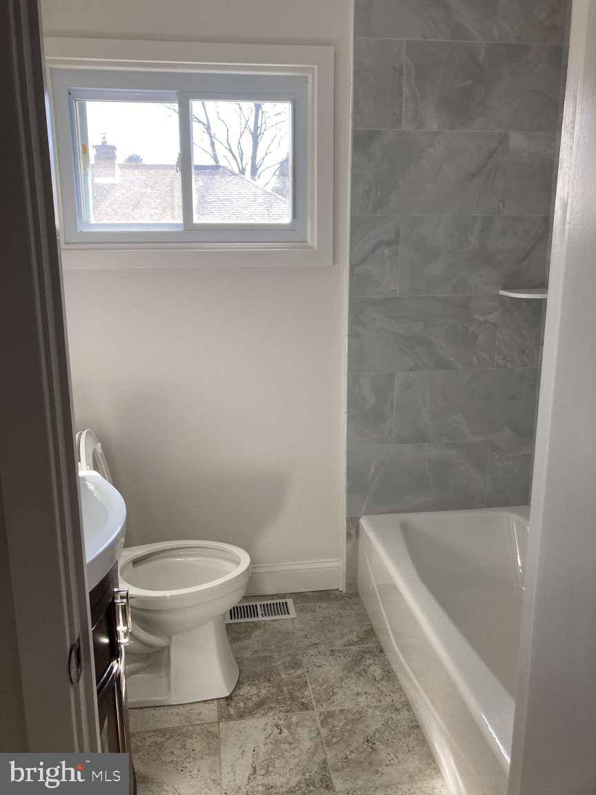 806 Rhodes Avenue Jenkintown, PA 19046 - Photo 10 of 16 a bathroom with a sink and a toilet