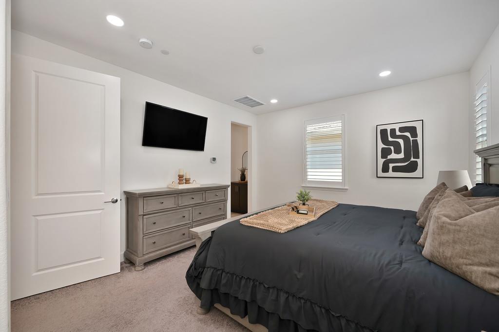 17500 Beachwood Road Lathrop, CA 95330 - Photo 43 of 78 a bedroom with a bed and a flat screen tv