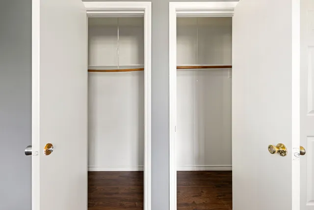 a bathroom with a toilet a sink a tub and mirror