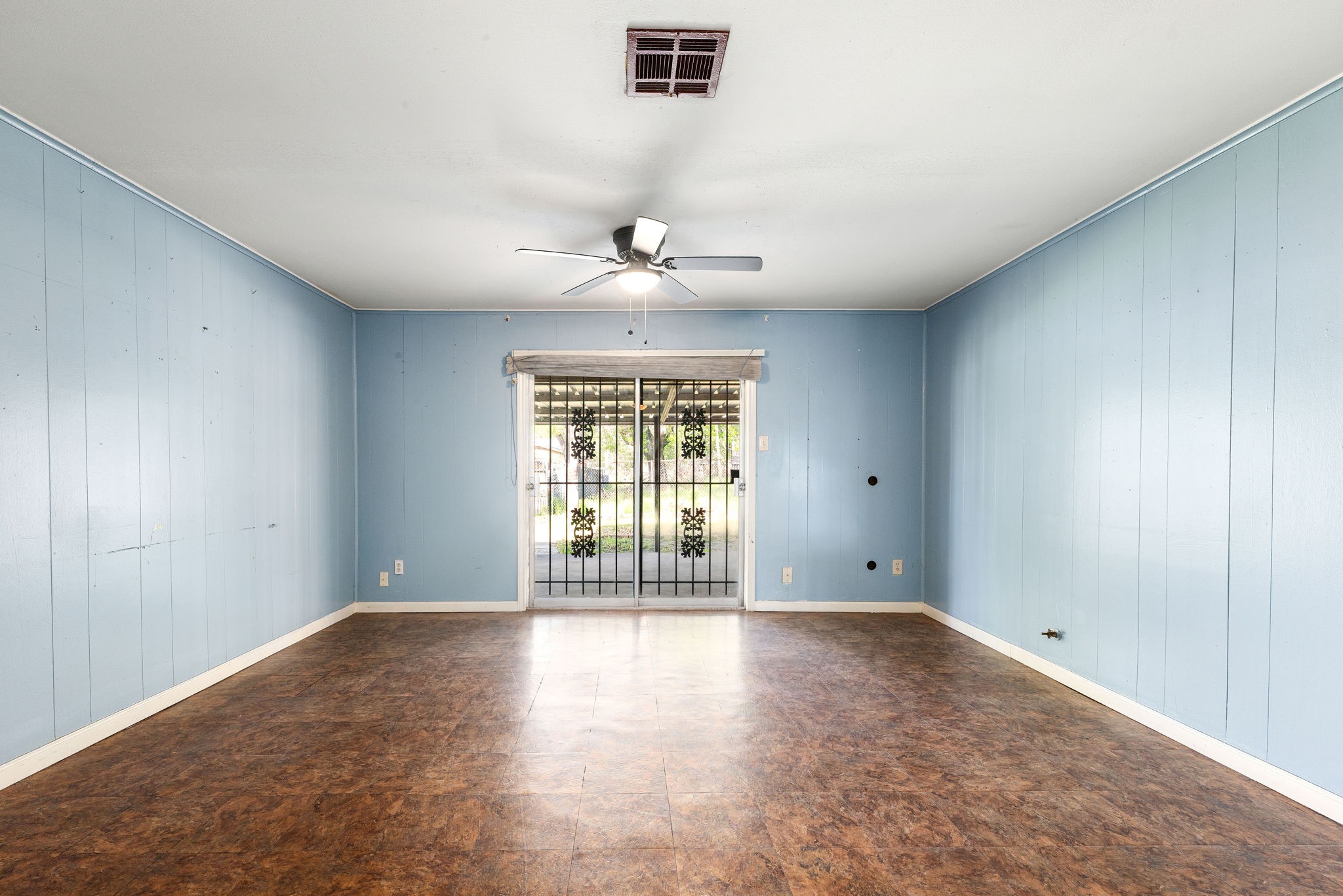 6515 Ashton Street Houston, TX 77091 - Photo 15 of 32 wooden floor in an empty room with a window