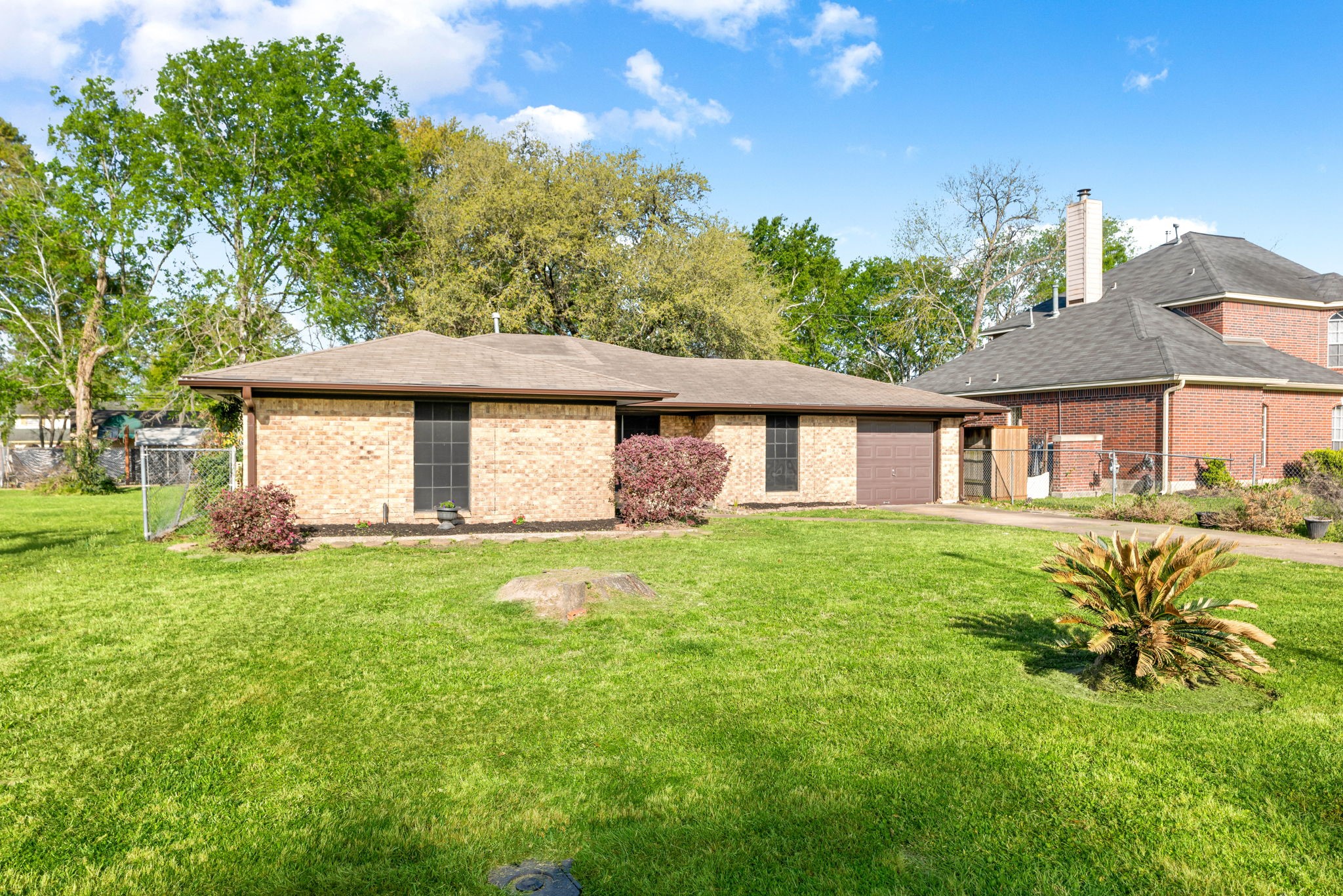 6515 Ashton Street Houston, TX 77091 - Photo 29 of 32 a view of a yard in front of a house with large trees