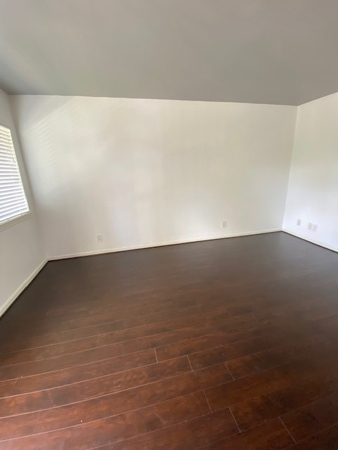 4701 Bell Street, Unit 4 Houston, TX 77023 - Photo 5 of 19 en empty room with wooden floor and windows