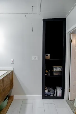 a room with water heater and storage