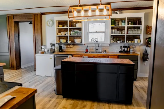 a kitchen with a sink and a refrigerator