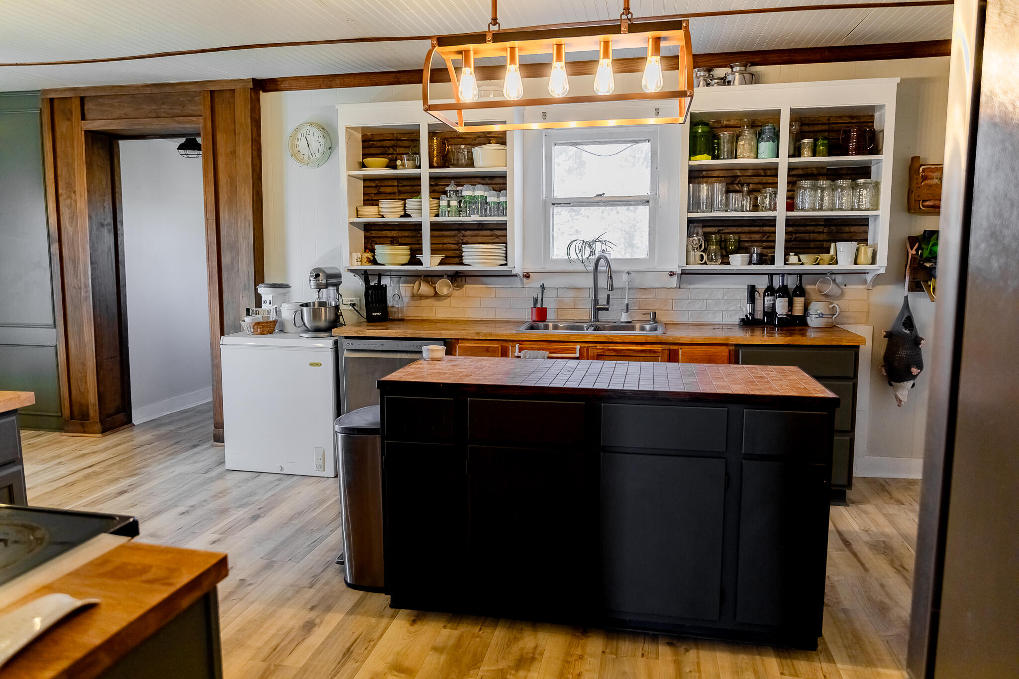 1398 County Road 155 Post, TX 79356 - Photo 14 of 26 a kitchen with a sink and a refrigerator