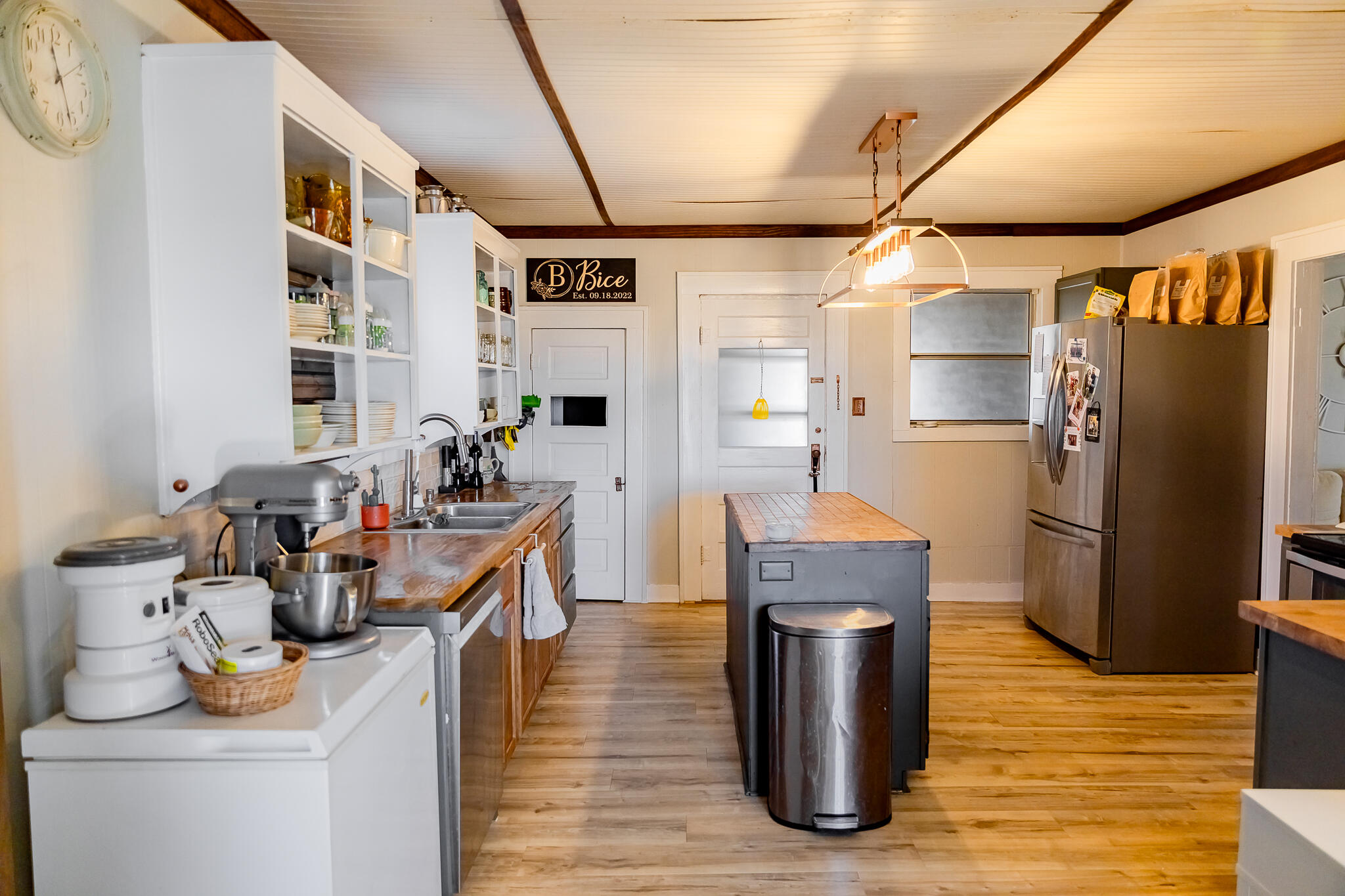 1398 County Road 155 Post, TX 79356 - Photo 16 of 26 a kitchen with stainless steel appliances granite countertop a refrigerator a stove and a wooden floors
