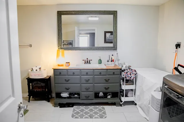 a bathroom with a sink and a mirror
