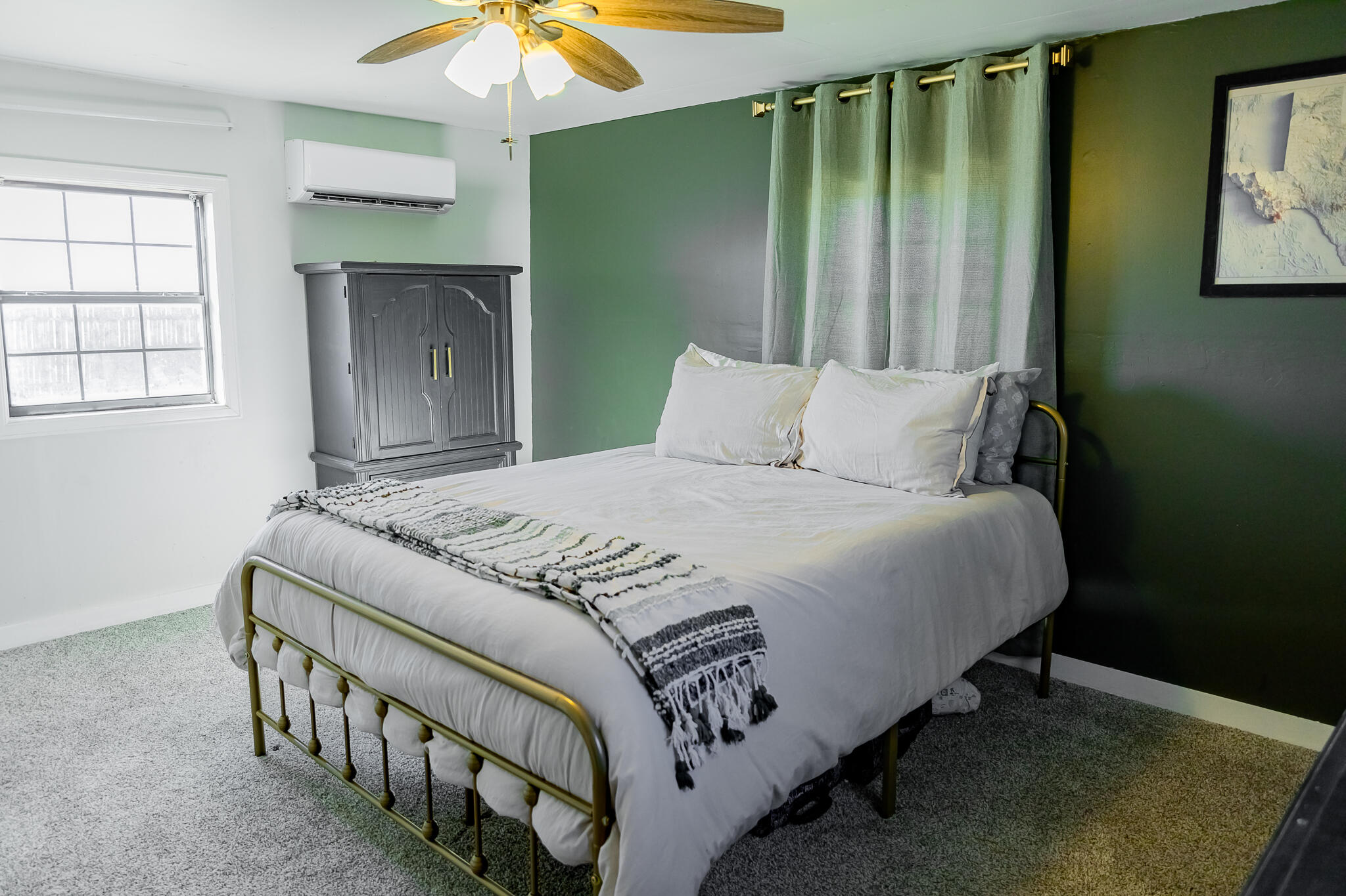 1398 County Road 155 Post, TX 79356 - Photo 22 of 26 a bedroom with a bed and a chandelier