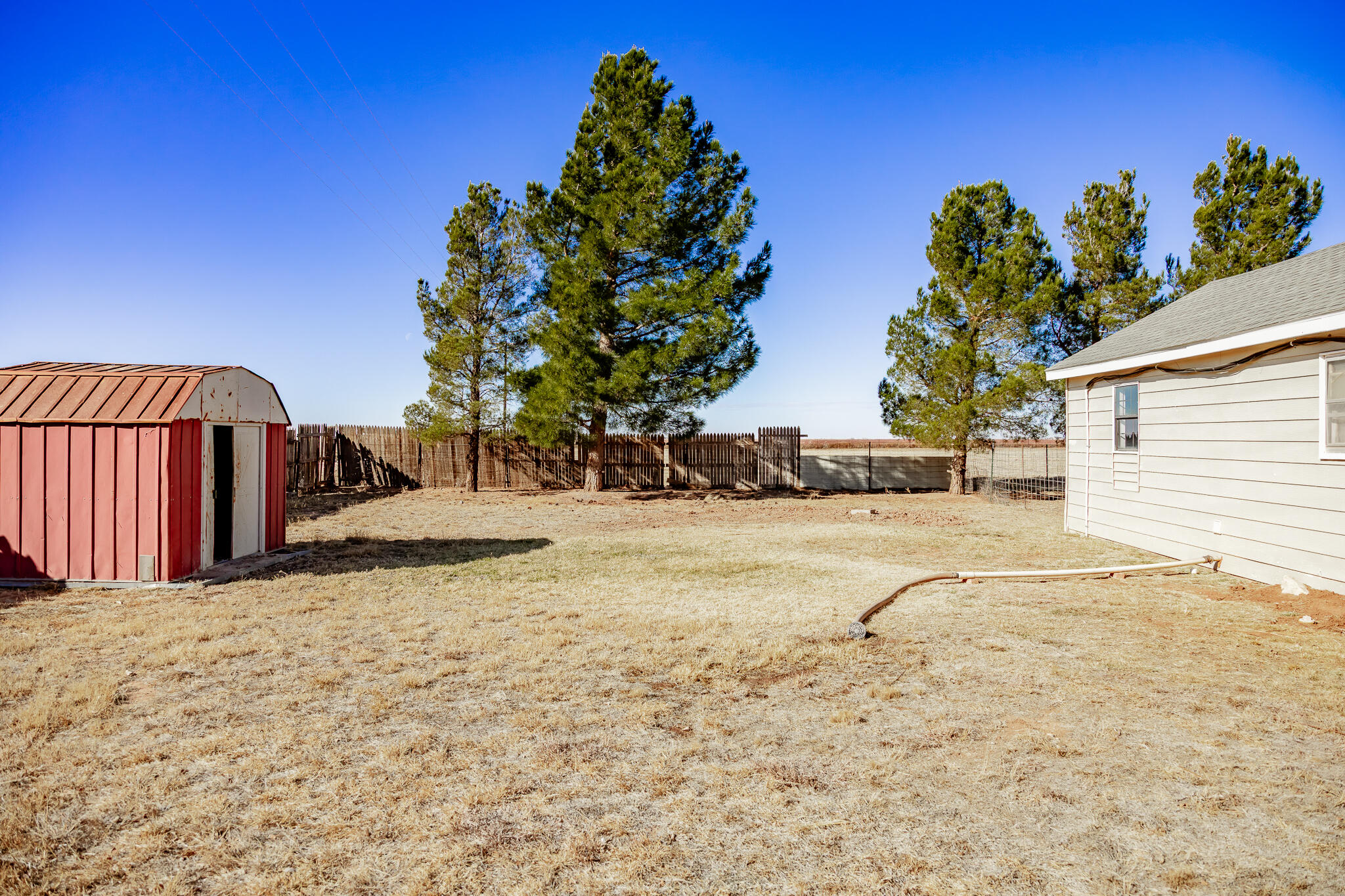 1398 County Road 155 Post, TX 79356 - Photo 24 of 26 a view of a backyard of the house