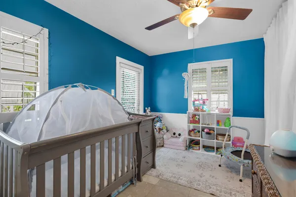 a bed room with a bed and a window