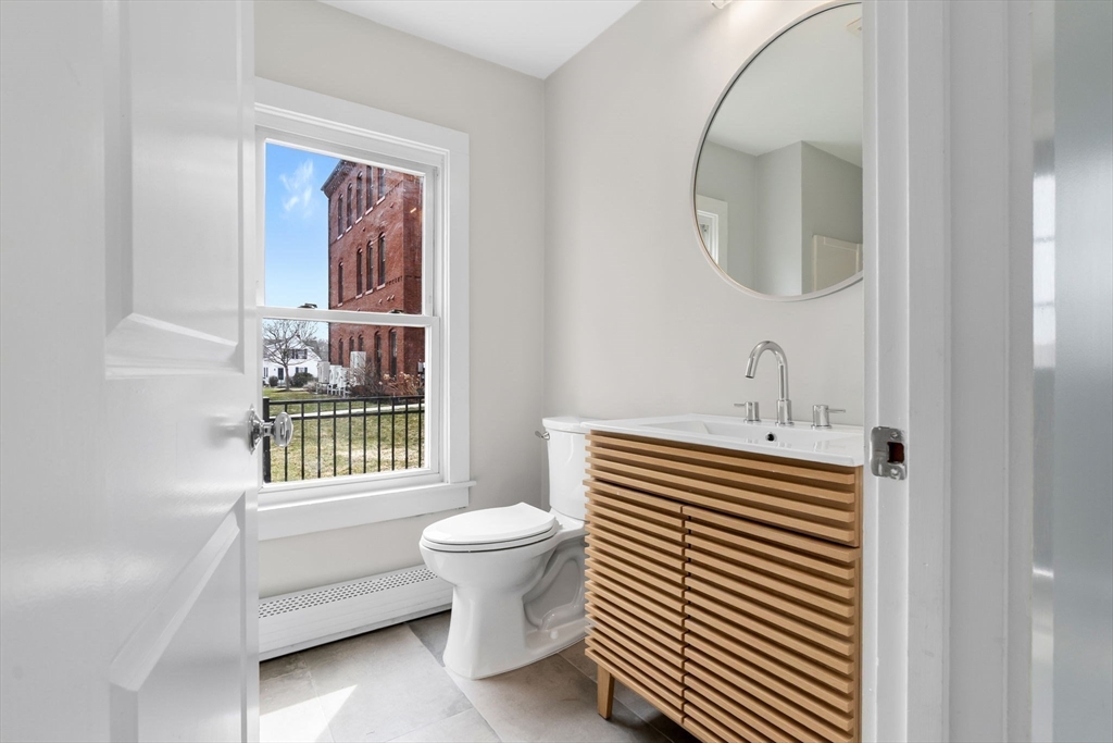 2 Perkins Street Amesbury, MA 01913 - Photo 14 of 36 a bathroom with a sink a toilet and a mirror