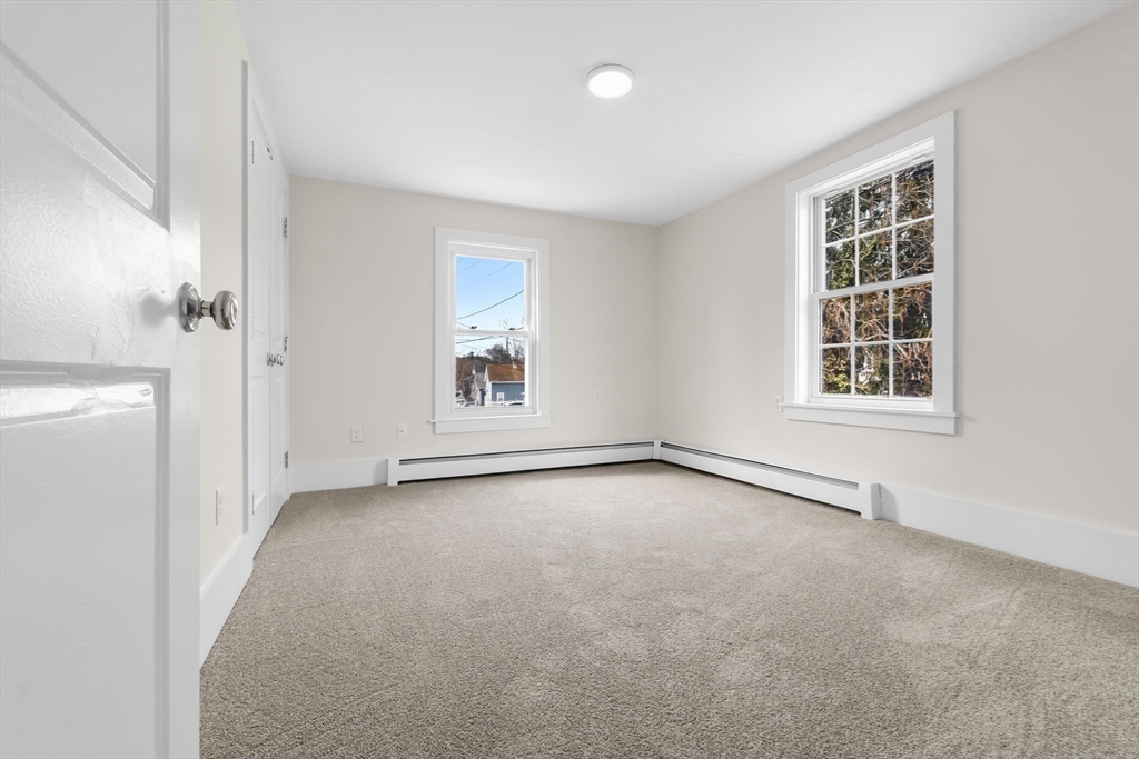 2 Perkins Street Amesbury, MA 01913 - Photo 20 of 36 an empty room with windows and closet