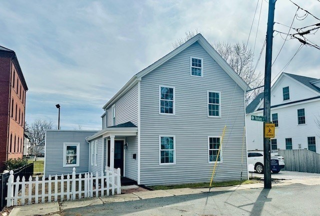2 Perkins Street Amesbury, MA 01913 - Photo 30 of 36 a front view of a house with a tree