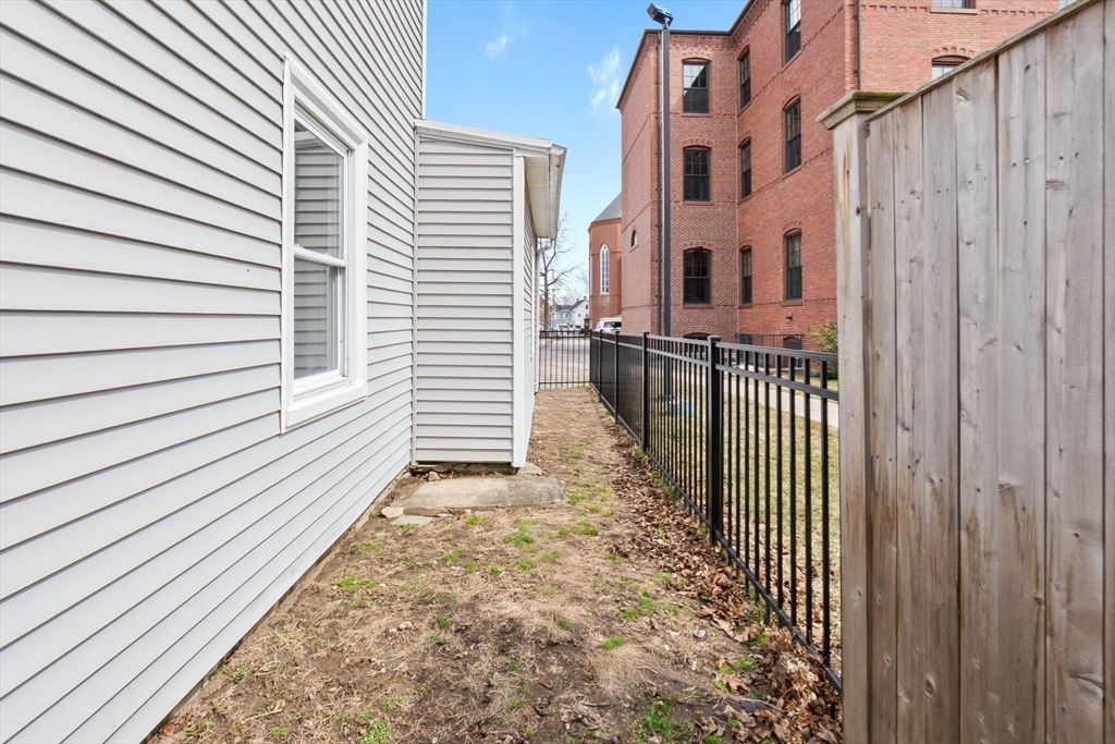 2 Perkins Street Amesbury, MA 01913 - Photo 32 of 36 a view of a pathway with a house