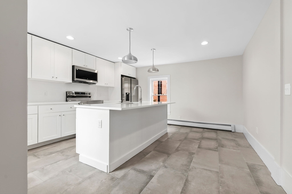 2 Perkins Street Amesbury, MA 01913 - Photo 4 of 36 a view of kitchen with sink and microwave