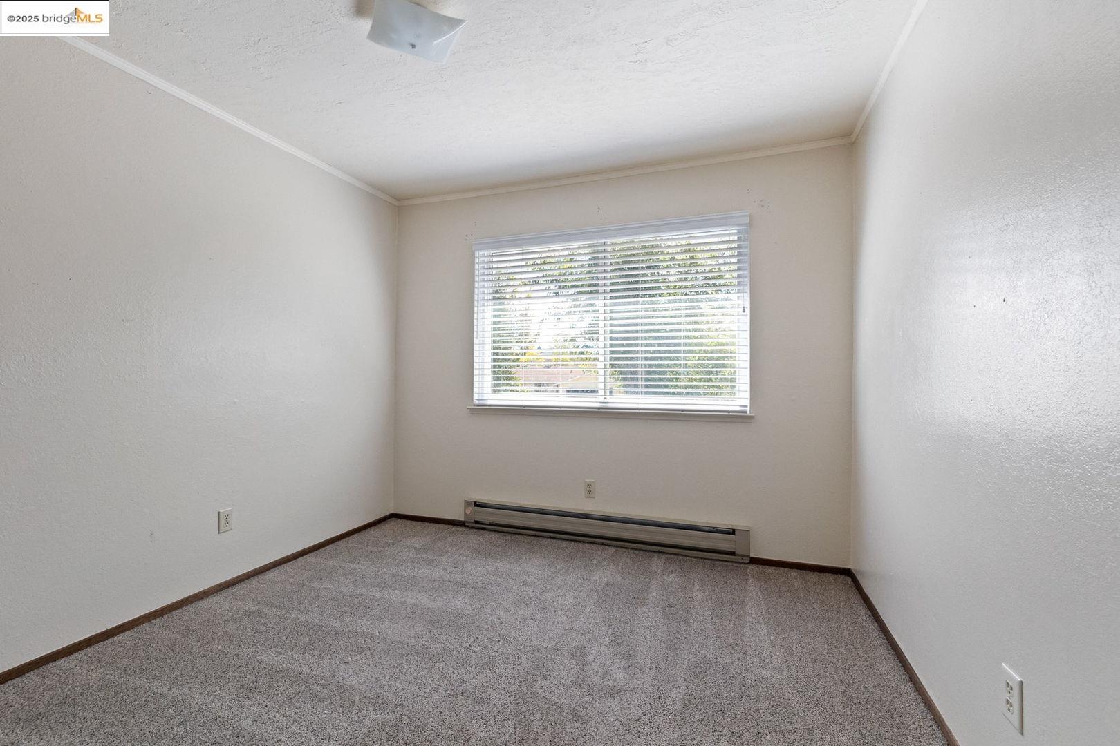 10562 Suzanne Court Jamestown, CA 95327 - Photo 9 of 14 an empty room with a window