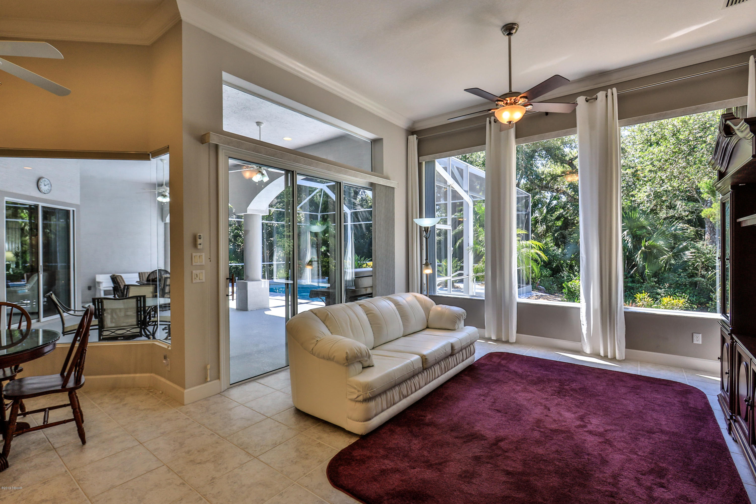 117 Beach Street Ponce Inlet, FL 32127 - Photo 18 of 37 a living room with furniture and a large window
