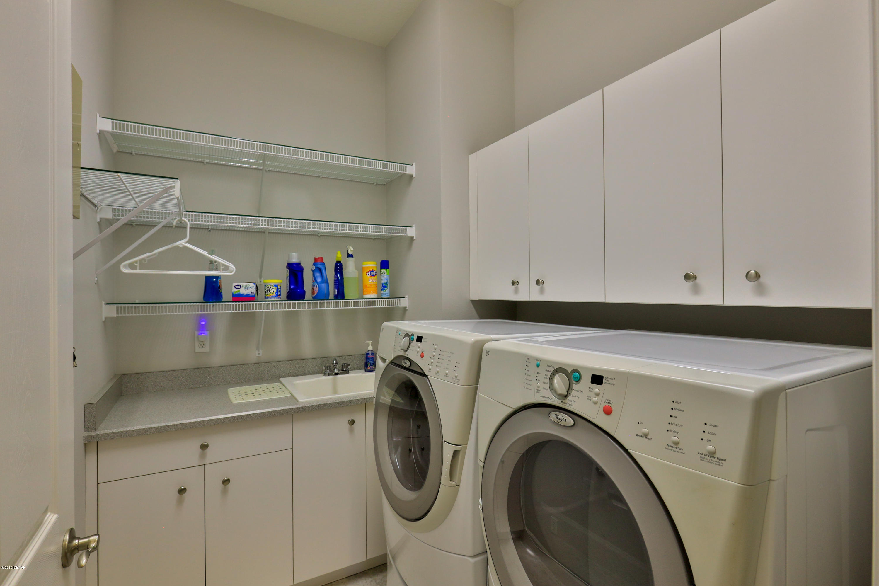 117 Beach Street Ponce Inlet, FL 32127 - Photo 27 of 37 a utility room with dryer and washer