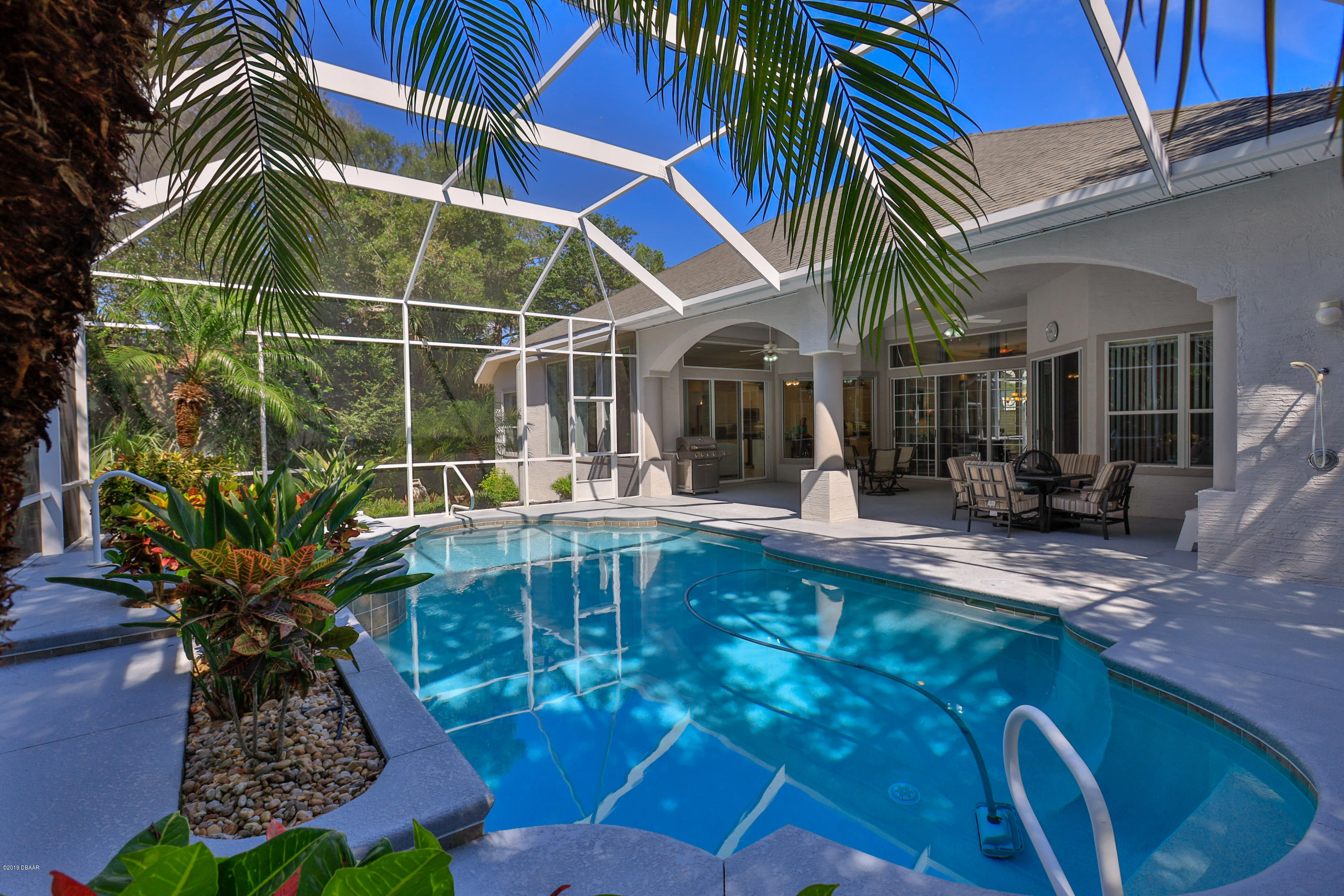 117 Beach Street Ponce Inlet, FL 32127 - Photo 5 of 37 a view of a house with backyard and sitting area