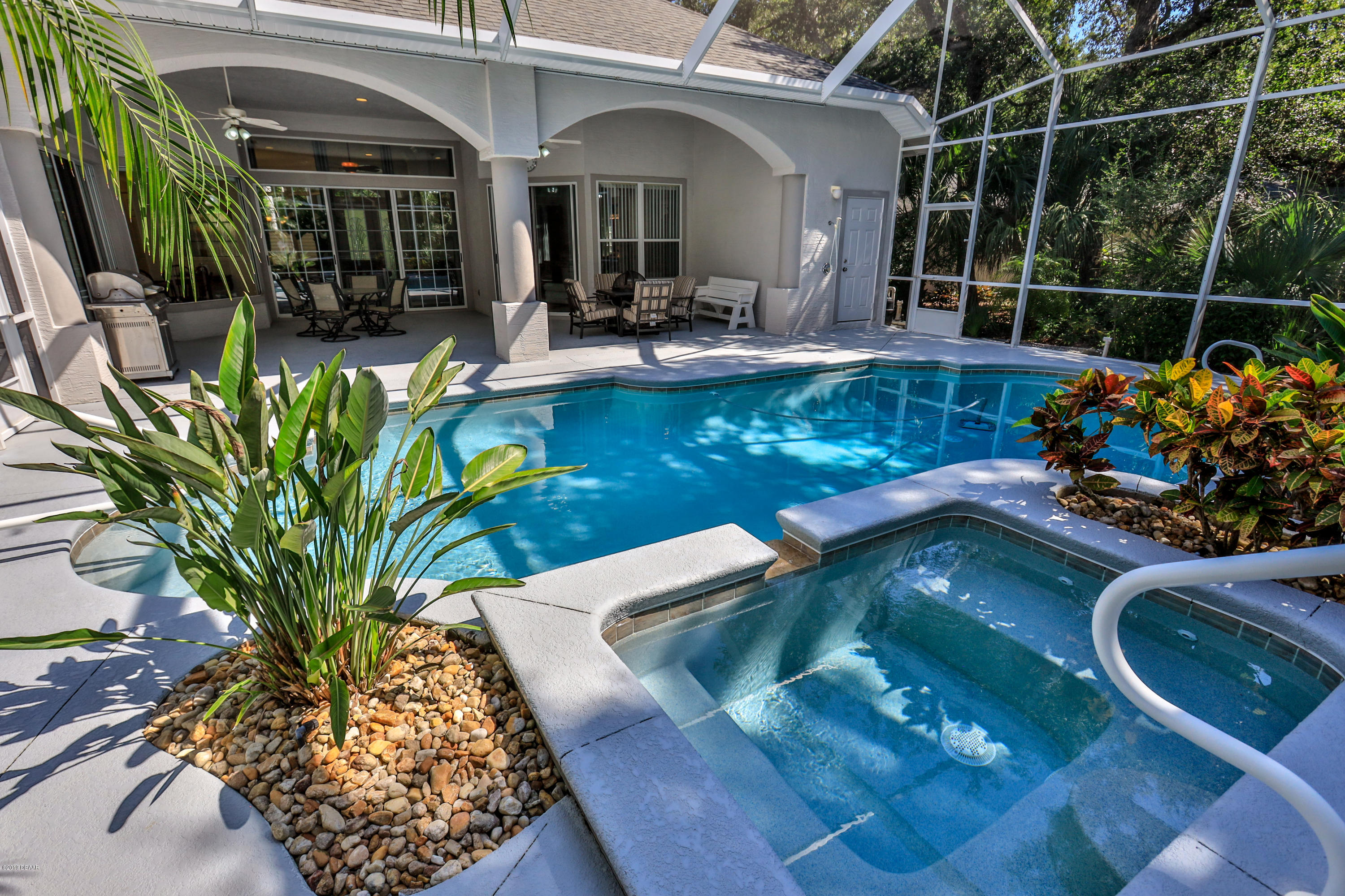 117 Beach Street Ponce Inlet, FL 32127 - Photo 8 of 37 a view of a house with a chairs in patio