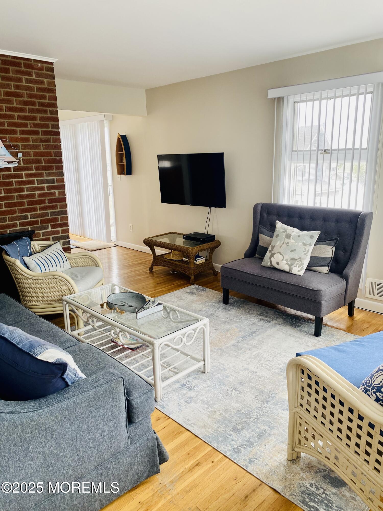 4 Camden Avenue, Unit UP Lavallette, NJ 08735 - Photo 7 of 10 a living room with furniture and a flat screen tv