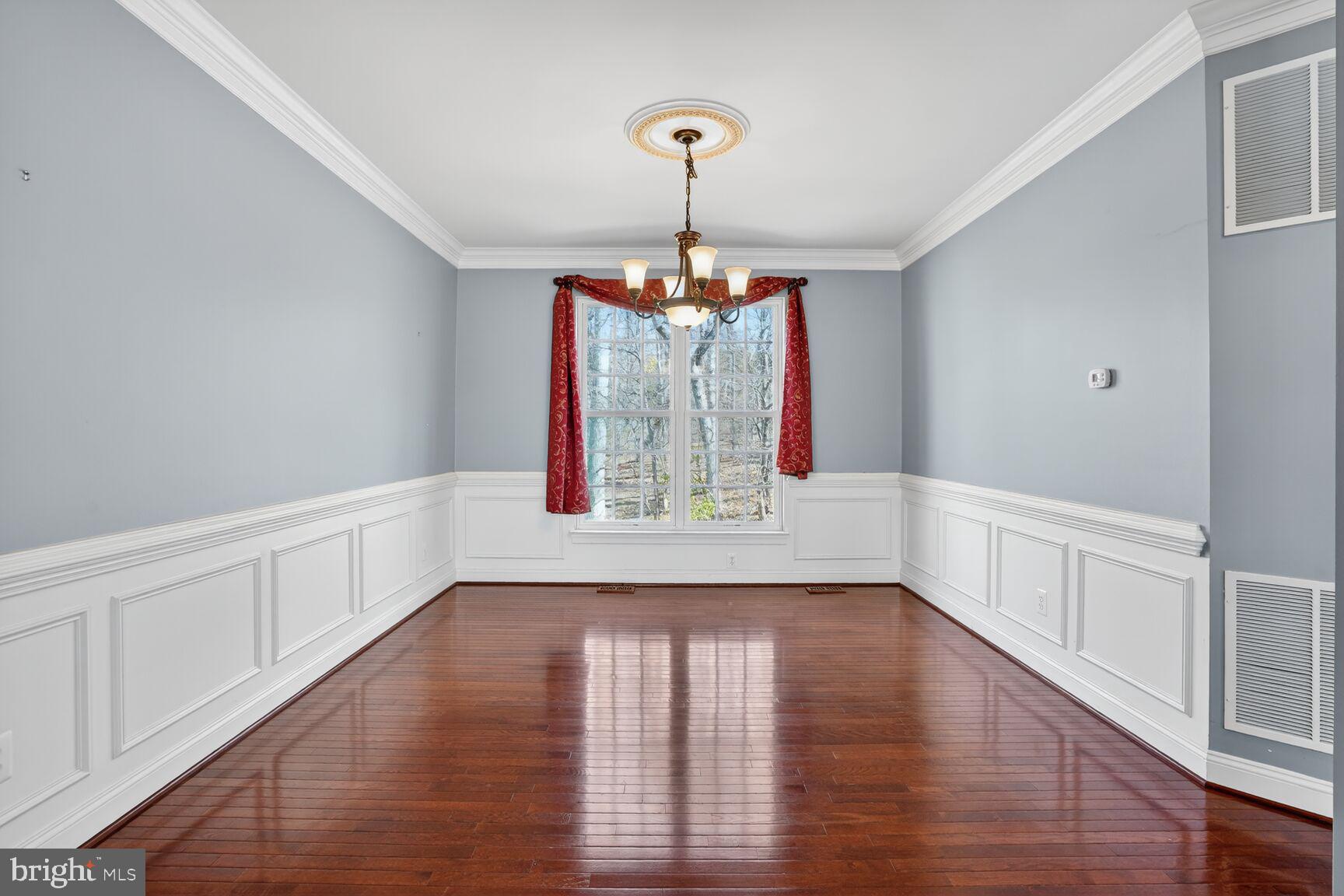 3308 McCorkle Court Triangle, VA 22172 - Photo 14 of 82 a view of an empty room with wooden floor and windows