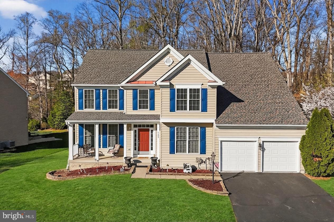 3308 McCorkle Court Triangle, VA 22172 - Photo 2 of 82 a front view of a house with a yard and trees