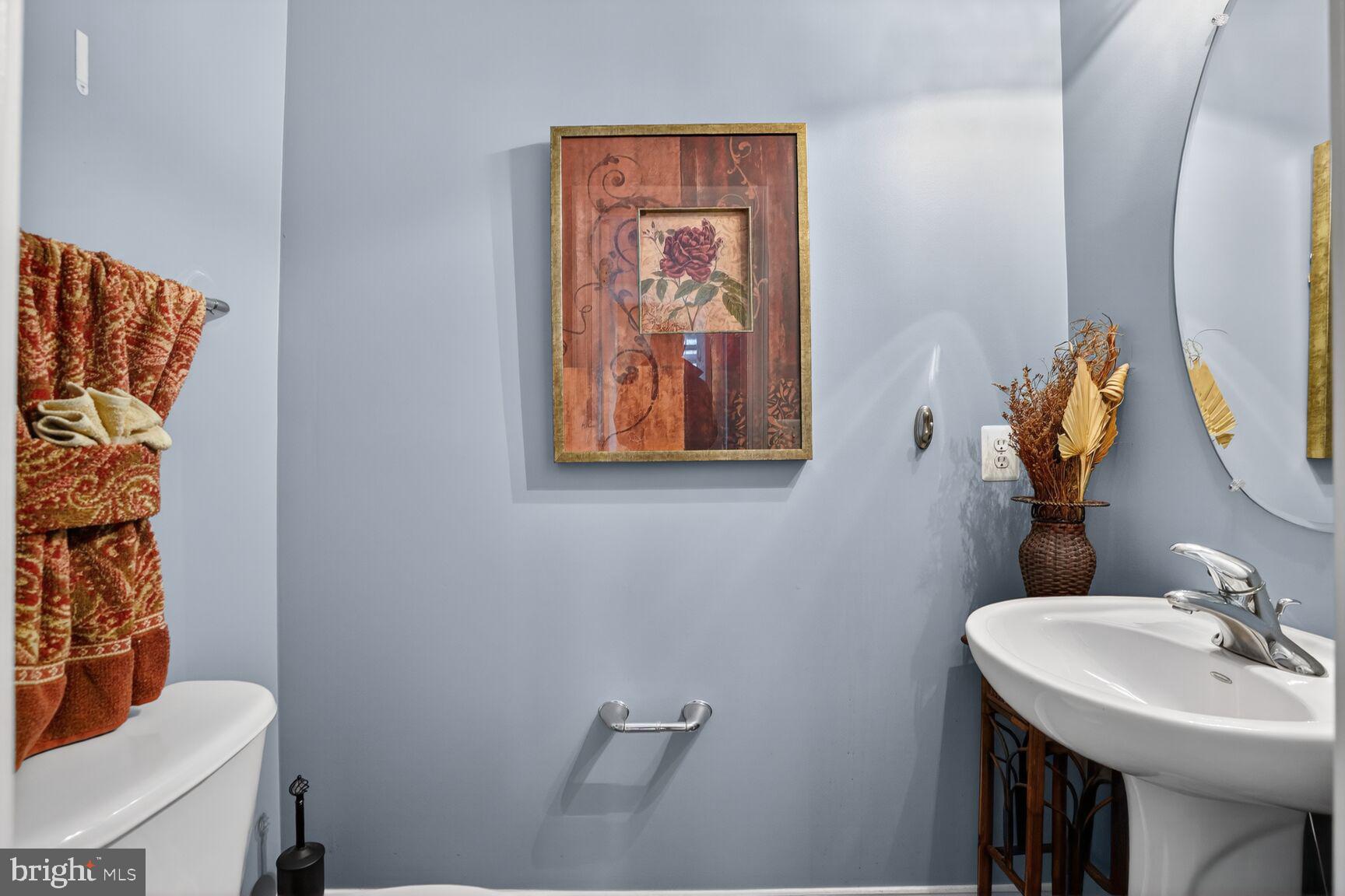 3308 McCorkle Court Triangle, VA 22172 - Photo 28 of 82 a bathroom with a sink mirror and toilet
