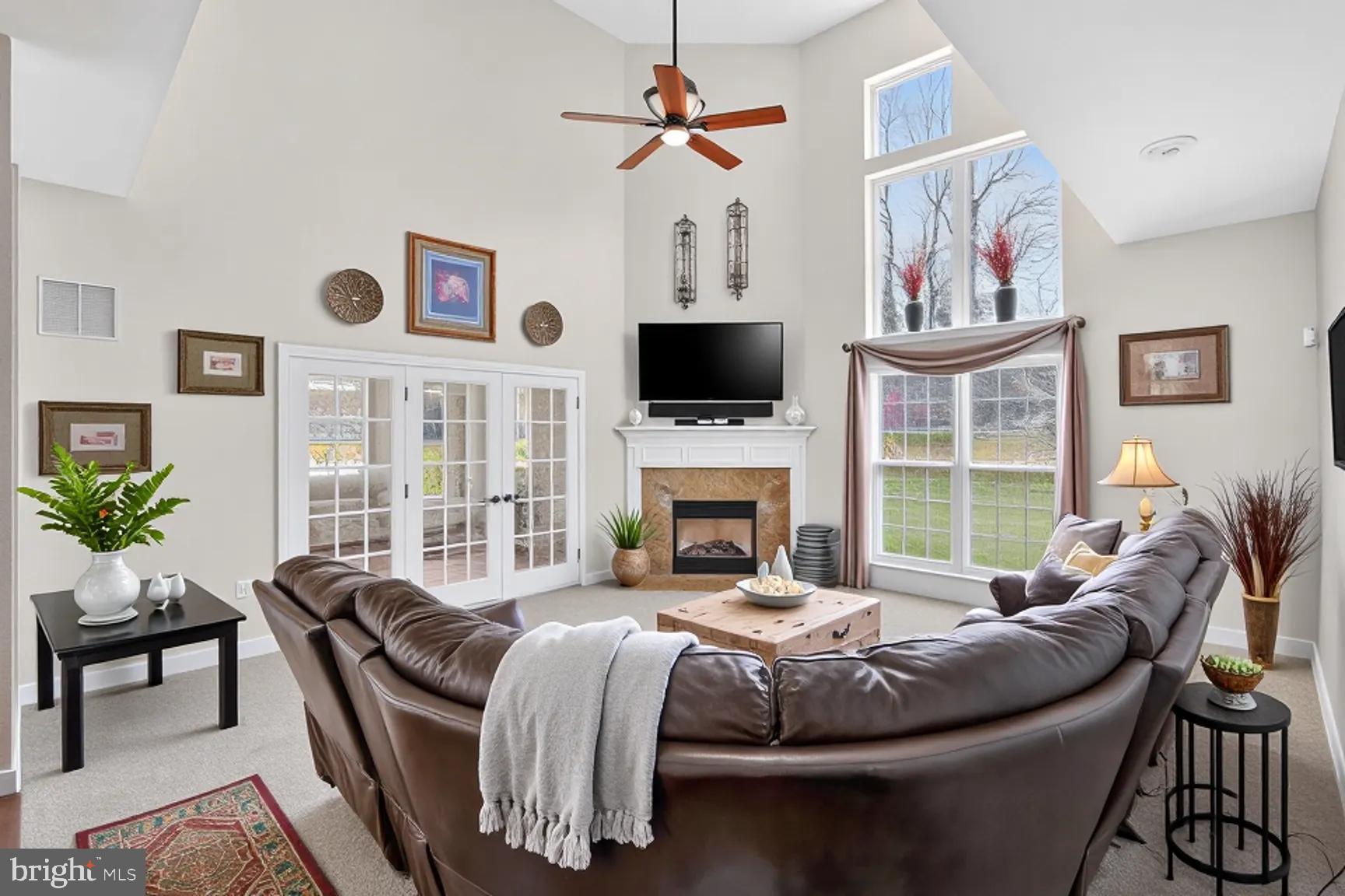 3308 McCorkle Court Triangle, VA 22172 - Photo 29 of 82 a living room with furniture a fireplace and a flat screen tv