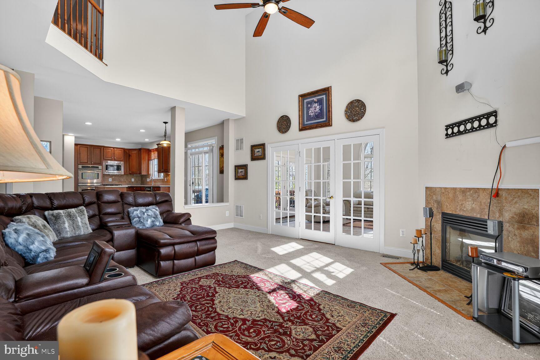 3308 McCorkle Court Triangle, VA 22172 - Photo 32 of 82 a living room with furniture wooden floor and a fireplace