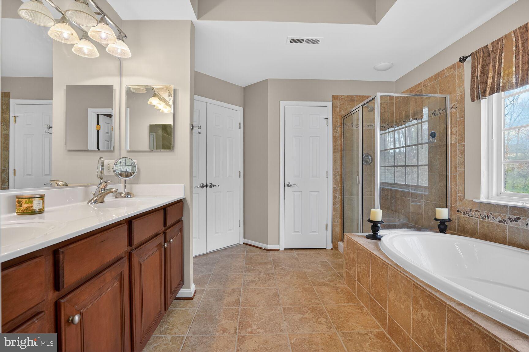 3308 McCorkle Court Triangle, VA 22172 - Photo 42 of 82 a spacious bathroom with a tub sink shower and mirror