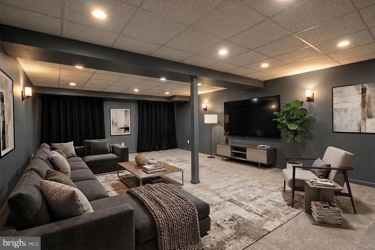 3308 McCorkle Court Triangle, VA 22172 - Photo 62 of 82 a living room with furniture a flat screen tv and a large window