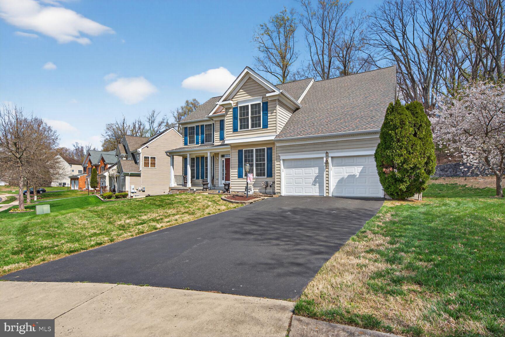 3308 McCorkle Court Triangle, VA 22172 - Photo 67 of 82 a front view of a house with a garden and yard