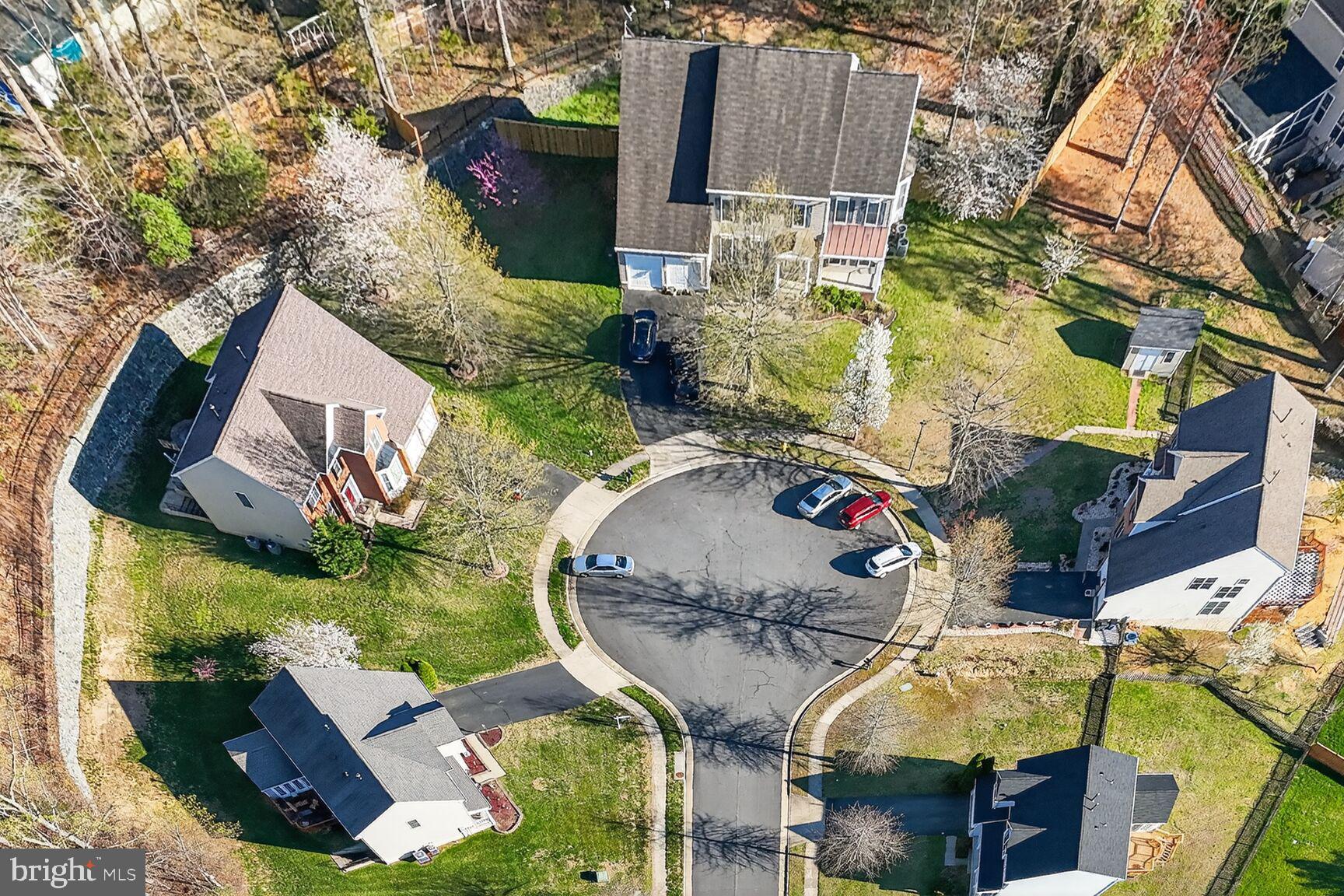 3308 McCorkle Court Triangle, VA 22172 - Photo 79 of 82 an aerial view of a house with swimming pool and large trees