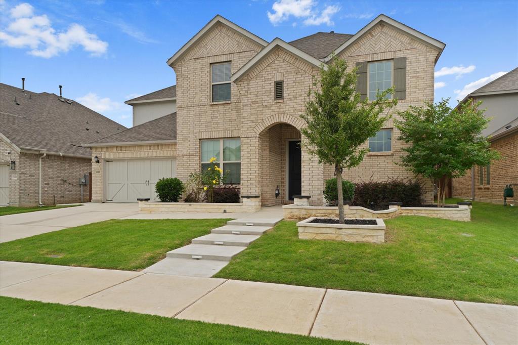 3533 Hyacinth Way Prosper, TX 75078 - Photo 1 of 38 a front view of a house with a yard and garage