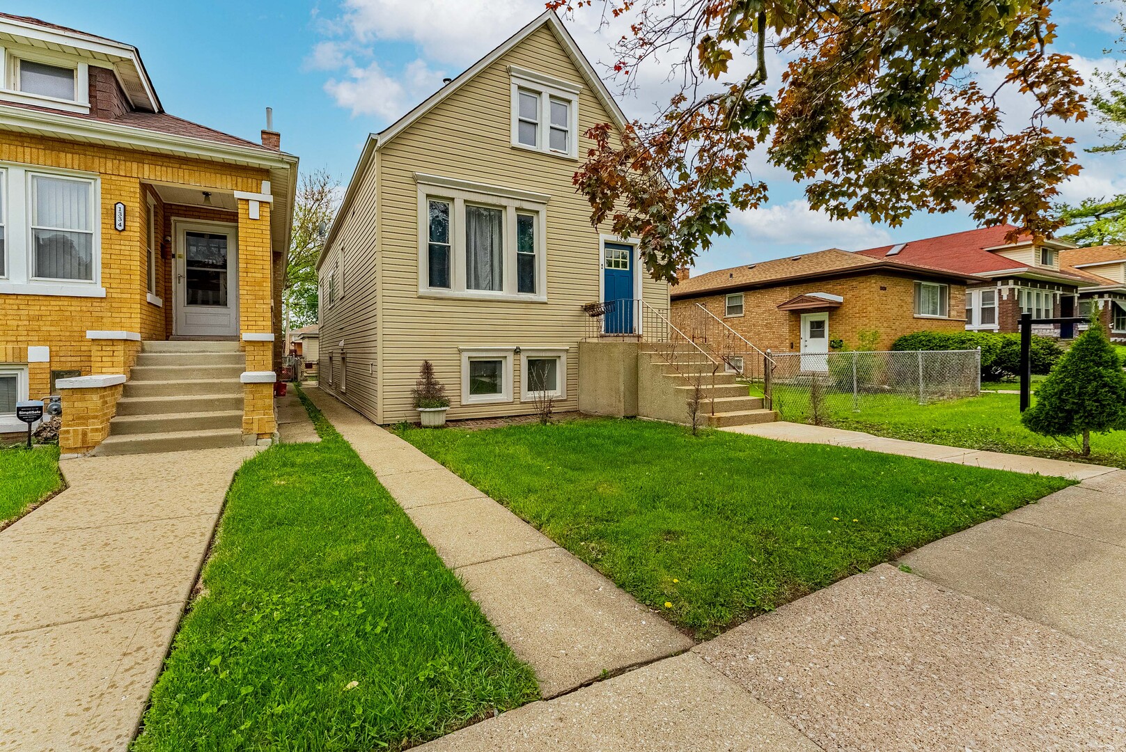 1330 Ridgeland Avenue Berwyn, IL 60402 - Photo 2 of 23 a front view of a house with a yard