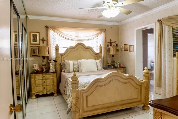 a bedroom with a bed and a mirror